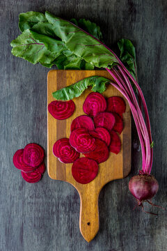 Sliced beets in cutting board 