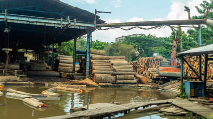 Fototapeta na wymiar log of timber being processed as the raw material for plywood manufacture industry