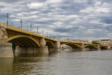 The yellow Margaret Bridge over the Danube River in Budapest, Hungary