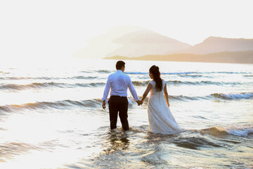 bride and groom on the beach