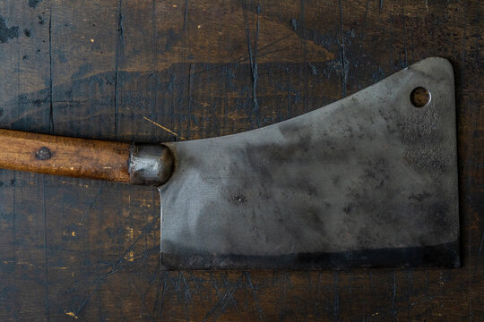 Meat clever on wood cutting board