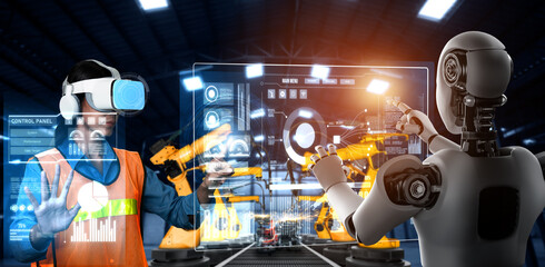 Mechanized industry robot and human worker working together in future factory . Concept of...