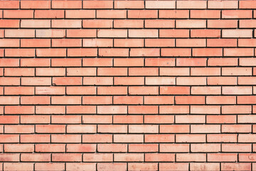 Fototapeta premium Red brick wall background outside of the building.