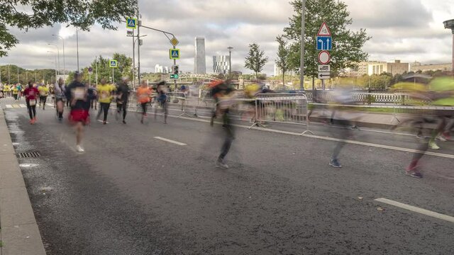 Mass Amateur race through the streets of the city, half marathon,  time lapse