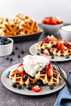 Liege waffle with berries and whipped cream