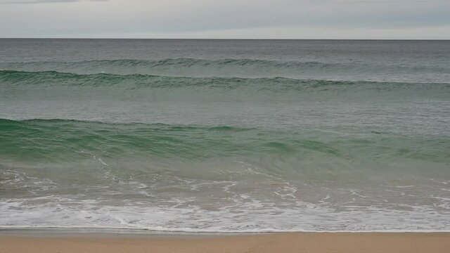 Large breaker waves crashing on shore, slow motion. Dail Mhor Beach, Isle of Lewis, Outer Hebrides, Scotland.