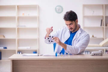 Young male doctor in vaccination concept