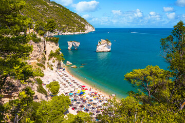 Obraz premium Panoramic view of famous Baia delle Zagare (Zagare Bay) or Baia dei Mergoli (Mergoli Bay) with Faraglioni di Puglia, Gargano National Park, Puglia, Italy