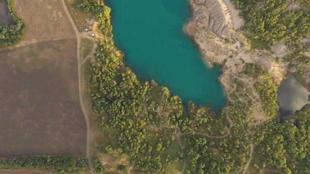 Konduki recreational park in Tula oblast. Aerial footage of turquoise lake in summer