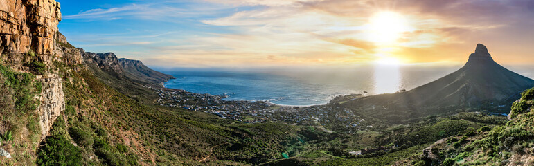 Stunning sunset sky dusk panoramic view from Table Mountain out towards Camps Bay and Lion's Head mountain - Great outdoors adventure and travel holiday destination, Cape Town, South Africa