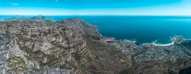 Table mountain from the top, looking out towards the Southern coastline with clear sky - Great outdoors adventure and travel holiday destination, Cape Town, South Africa