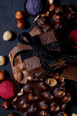 Chocolates background. Chocolate. Assortment of fine chocolates in white, dark, and milk chocolate. Praline Chocolate sweets