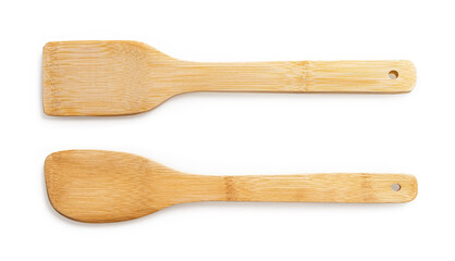Set of two wooden spatulas for cooking isolated on white background. Simple rustic kitchenware of eco-friendly materials. New bamboo kitchen utensils for zero waste and green living lifestyle.