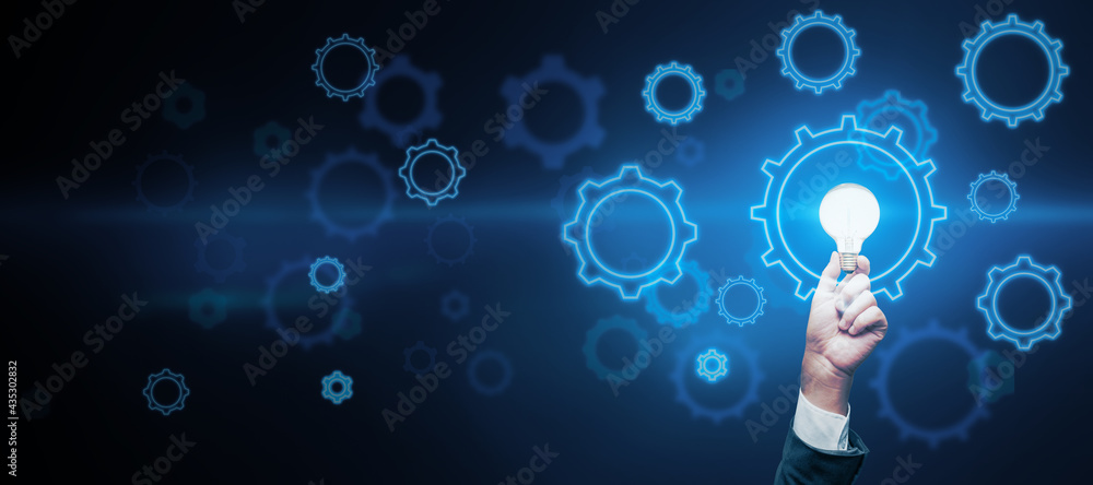 Poster abstract dark wallpaper with copyspace and man hand with light bulb and digital gears around, idea c