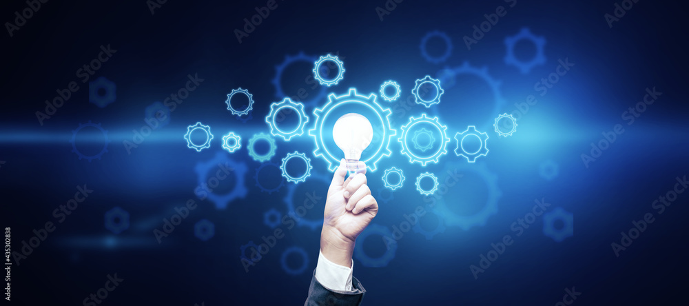 Poster creative idea and innovation concept with man hand carrying light bulb surrounded by digital gears o