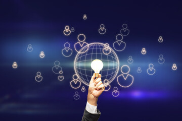Online service project to donate concept with bright white light bulb in businessman hand with digital circle and surrounded human figures symbols on abstract dark backdrop.