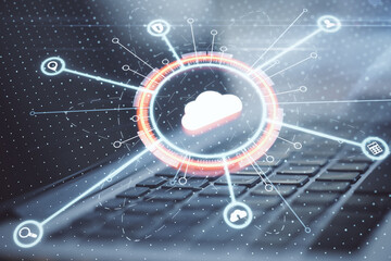 Cloud computing service concept with digital cloud sign with internet service icons on laptop keyboard background. Double exposure.