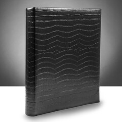Beautiful black leather photo album with white sheets for mounting. Studio photography. Graphic resource.