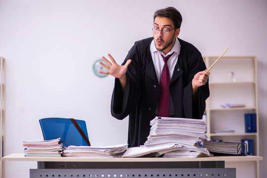 Funny Young Male Employee Magician And Too Much Work In The Office