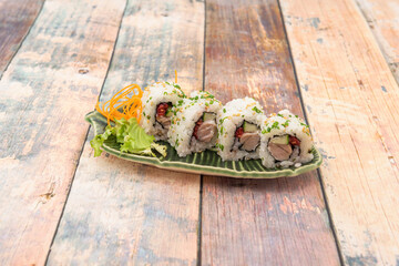 Red tuna, bluefin tuna, maguro in roll with pepper, avocado, rice, chives and sesame seeds