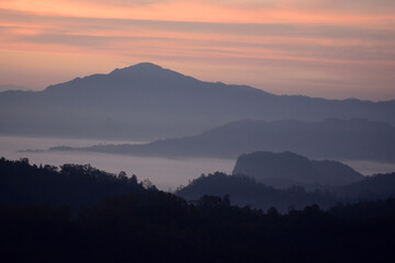 mountains hill range under mist and fog