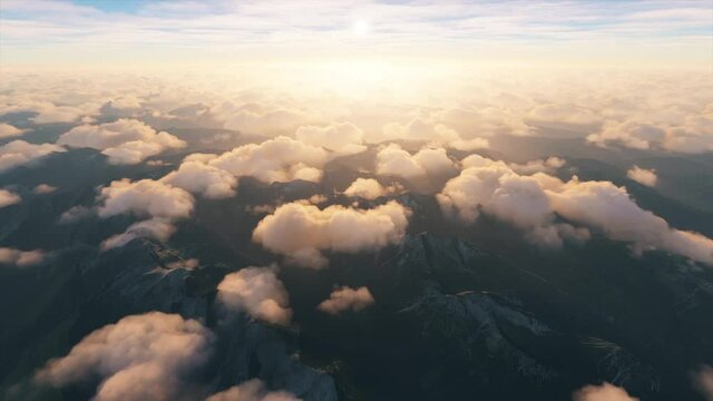 View of clouds over the mountains with the sun over the horizon before sunset