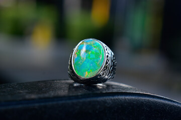 Opal is a silver ring decorated with an opal.