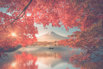 Colorful Autumn Season and Mountain Fuji with morning fog and red leaves at lake Kawaguchiko is one...