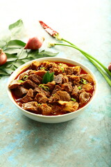 Bowl of spicy hot Indian mutton korma, rosat curry,