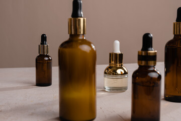 Eco Mineral oil in Amber glass bottles with pipette. Transparent hyaluronic serum gel and skin care concept. Top horizontal view copyspace of dropper glass.