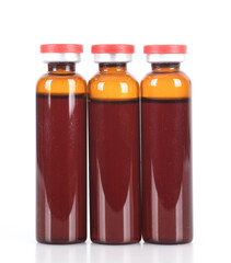 Bottled medicine on white background