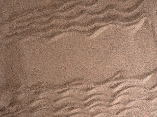 Fototapeta na wymiar Waves in the sand, mine space, top view.