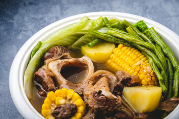 Bulalo- is a beef dish from the Philippines. It is a light colored soup that is made by cooking beef shanks and bone marrow until the collagen and fat has melted into the clear broth.