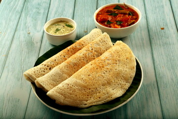 Homemade healthy food- rice dosa with sambar and coconut chutney.