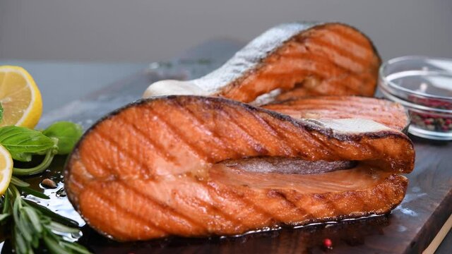 Salmon fillet steaks on a cutting board in the kitchen