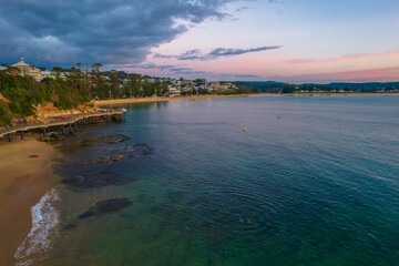 Aerial sunrise seascape with storm clouds rolling in