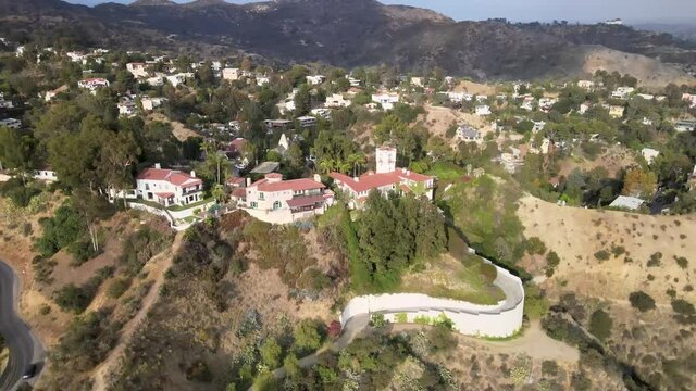 Aerial descending over million dollar houses in Hollywood Hills, Los Angeles