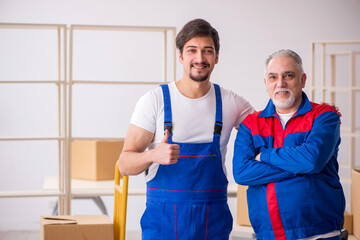 Two male professional movers doing home relocation