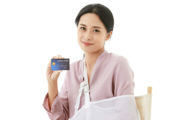 Isolated cutout shot of Asian young happy female patient sitting on chair smiling look at camera...