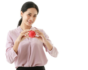 Portrait closeup isolated cut out shot of Asian young happy hospital blood donor patient hold red rubber heart in hands on chest in front white background with copy space for insurance advertisement