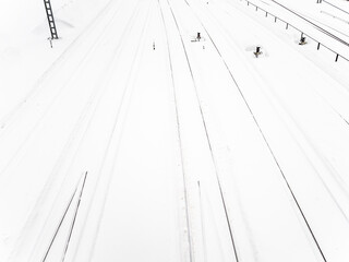 above view of snow-covered railways at station