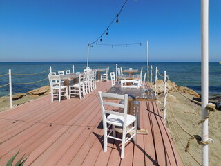 empty tables in a cafe on the beach. Larnaca. Cyprus