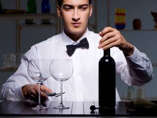 Professional sommelier tasting wine in restaurant
