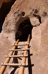 ancient native american cave dwelling  and ladder at bandelier national monument, near los alamos,...