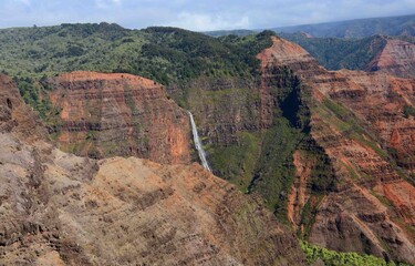      waipo'o falls   as seen from waimea canyon overlook , kauai, hawaii, on a sunny day    