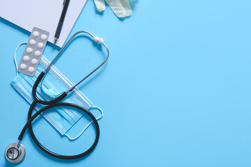 Composition with modern stethoscope on color background