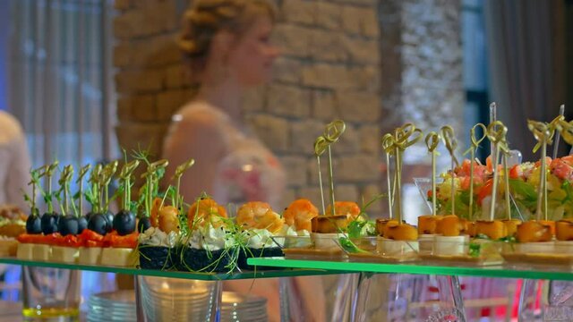Beautifully decorated catering banquet table with snack canape in restaurant or hotel. catering service bisiness waiter buffet food set in event celebratoin corporate birthday kids party or wedding