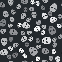 Obraz premium Grey Alien icon isolated seamless pattern on black background. Extraterrestrial alien face or head symbol. Vector