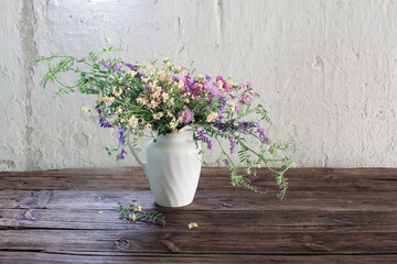 summer wild flowers on old wooden table