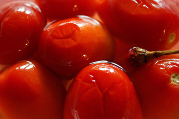 red tomatoes in marinade close-up